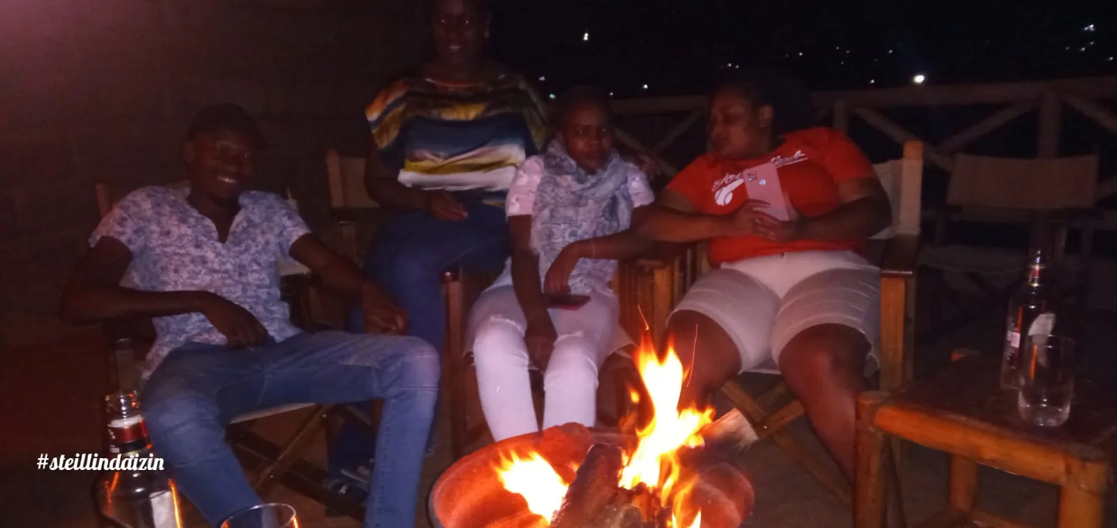 Friends around a bonfire at night